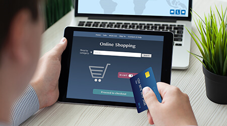 man online shopping on tablet