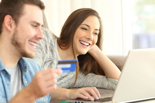 Young couple making purchase online